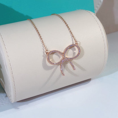 [Rose Tomorrow]CLAW SET RHODIUM PLATED BOW NECKLACE