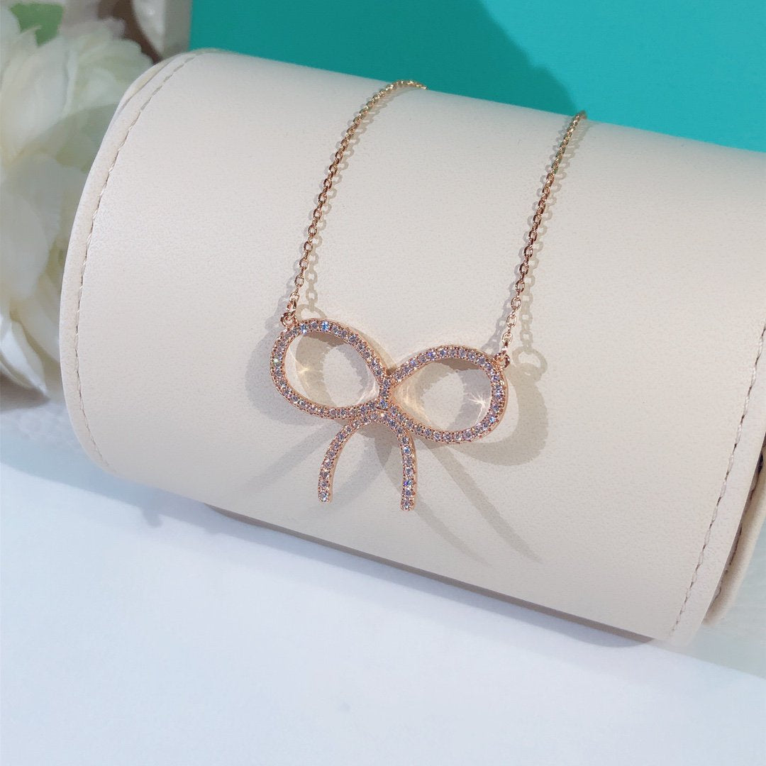 [Rose Tomorrow]CLAW SET RHODIUM PLATED BOW NECKLACE
