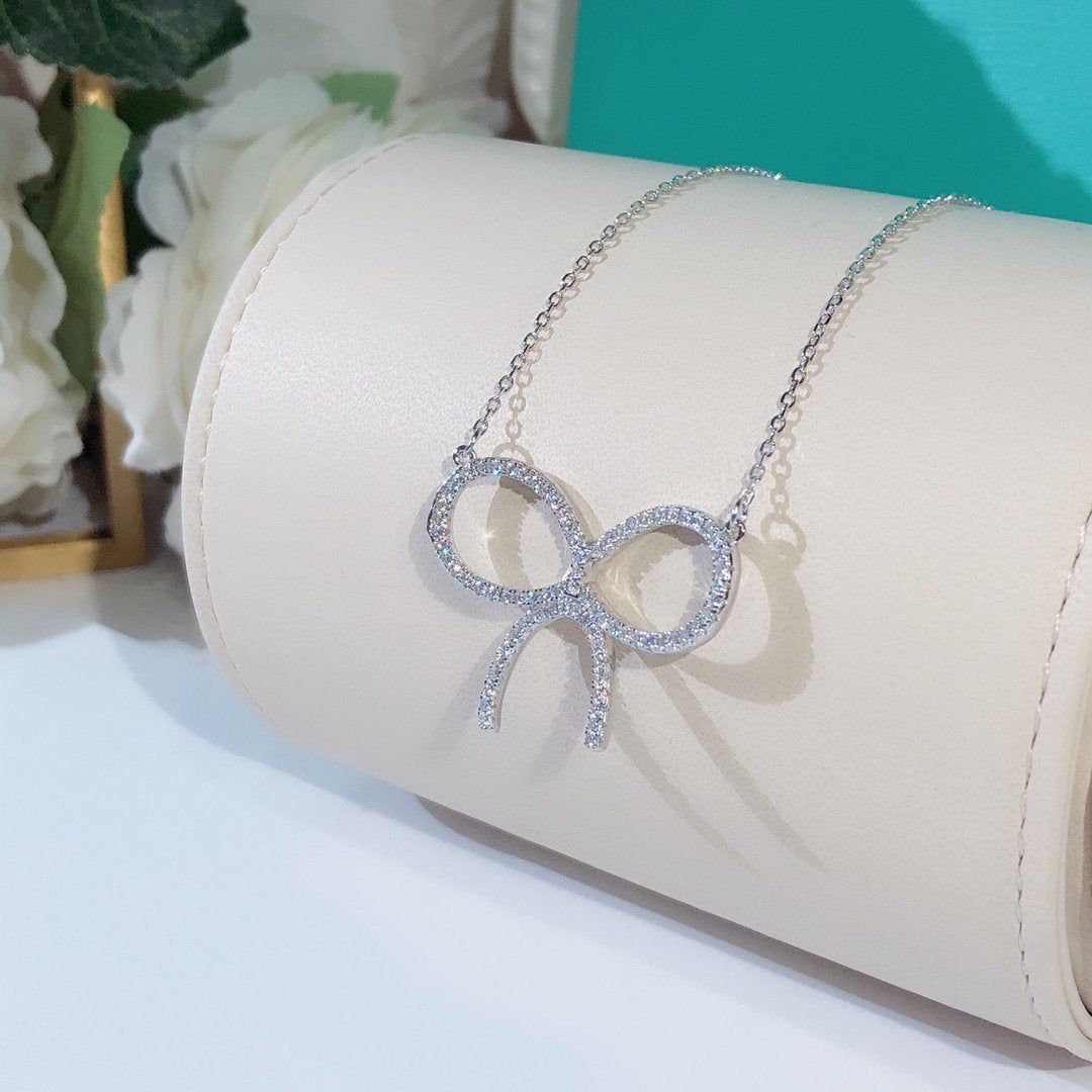 [Rose Tomorrow]CLAW SET RHODIUM PLATED BOW NECKLACE