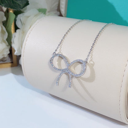 [Rose Tomorrow]CLAW SET RHODIUM PLATED BOW NECKLACE