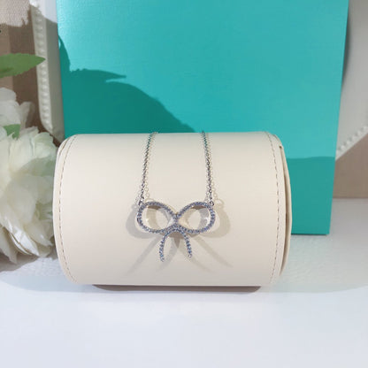 [Rose Tomorrow]CLAW SET RHODIUM PLATED BOW NECKLACE
